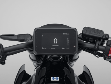 Motorcycle digital dashboard display showing speed and controls.