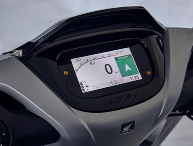 Motorbike digital dashboard displaying speedometer and navigation.