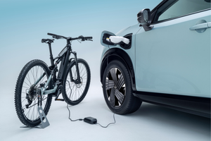 Electric bike charging from an electric car's charging port.