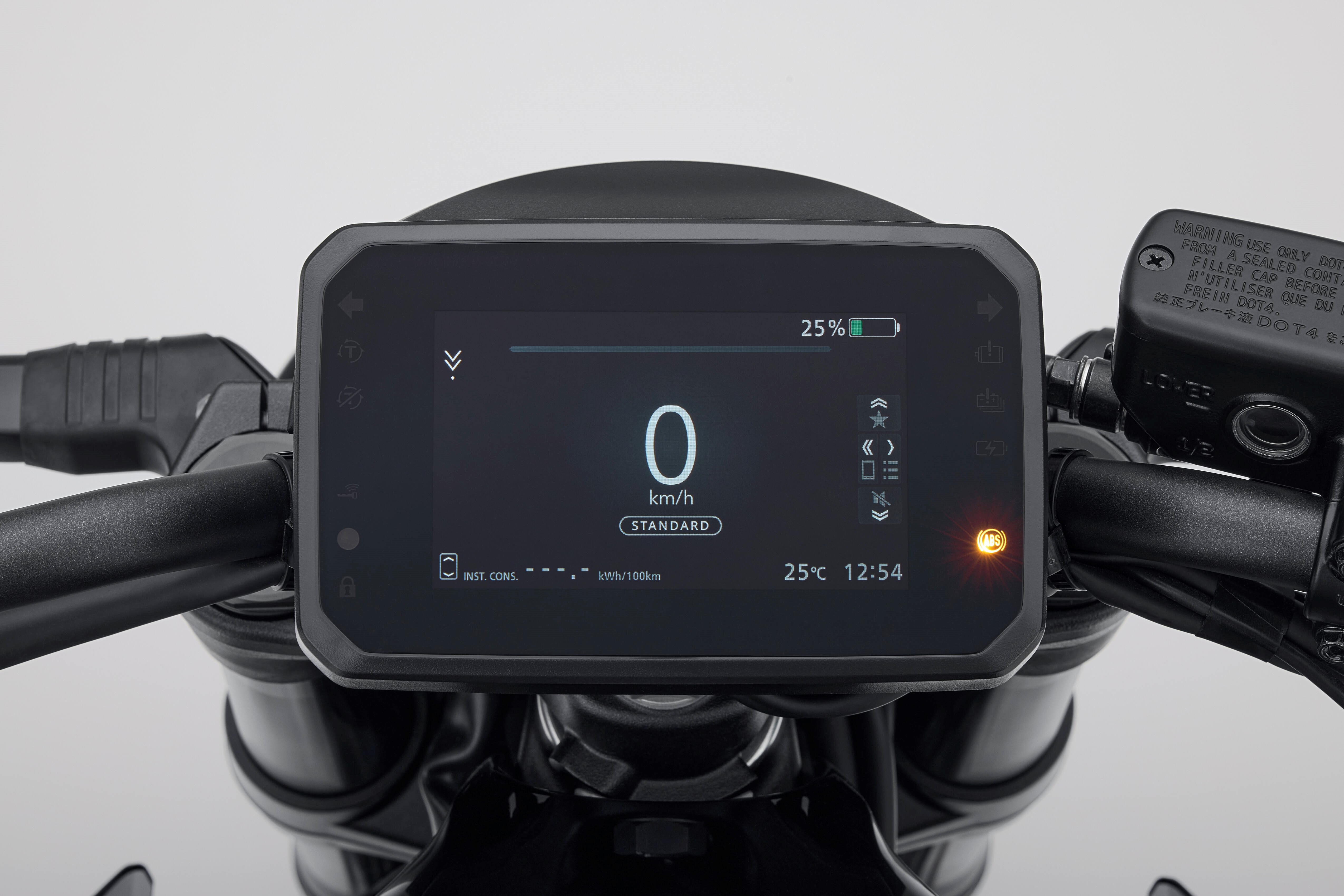 Motorcycle digital display showing speed, temperature, time, and ABS warning light.