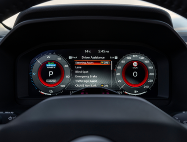Car dashboard showing digital speedometer and driver assistance features.