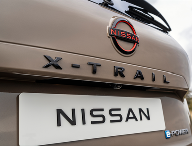 Close-up of the rear of a Nissan X-Trail e-Power with logo and nameplate visible.