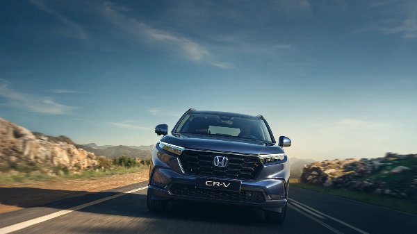 Honda CR-V driving on the road.