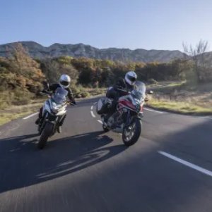 2 honda bikes on road