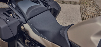 Close-up of motorbike seat and panniers, view from above.