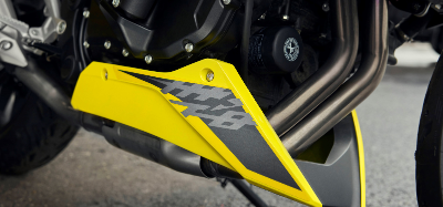 Close up of yellow and grey Honda CB750 Hornet engine