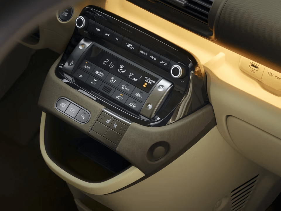 Wireless charging available in the compact centre console. https://www.brayleys.co.uk/assets/media/hyundai_inster_2024_interior_4.png