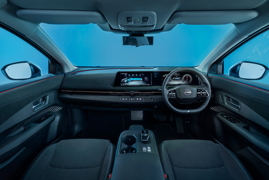 Interior view of a modern car dashboard and steering wheel.