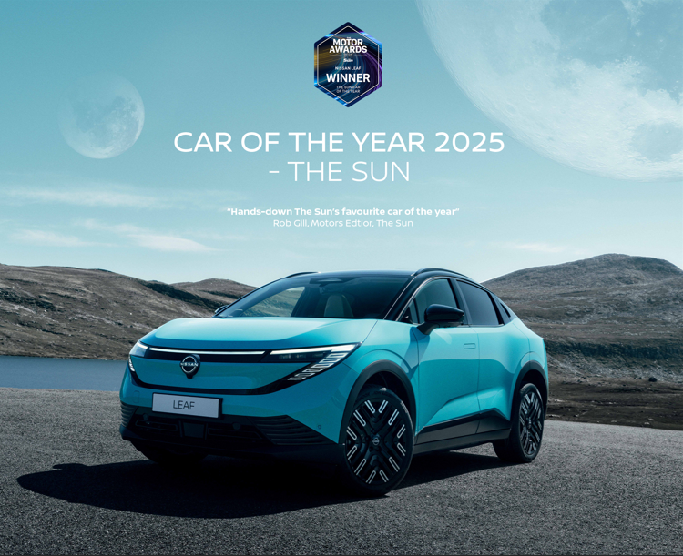 Electric car with award text Car of the Year 2025 - The Sun and mountainous landscape.