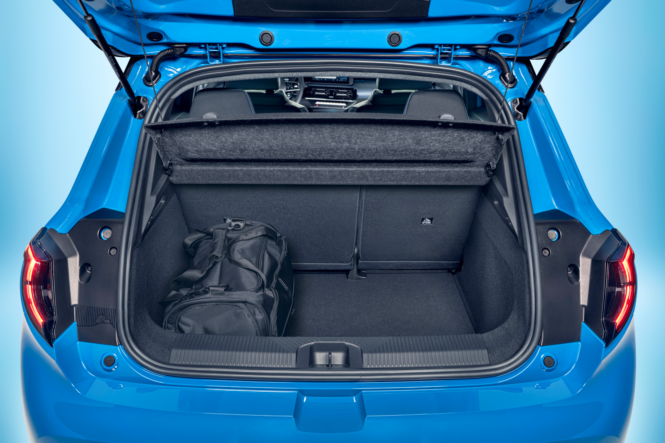 Open car boot with a black bag inside.