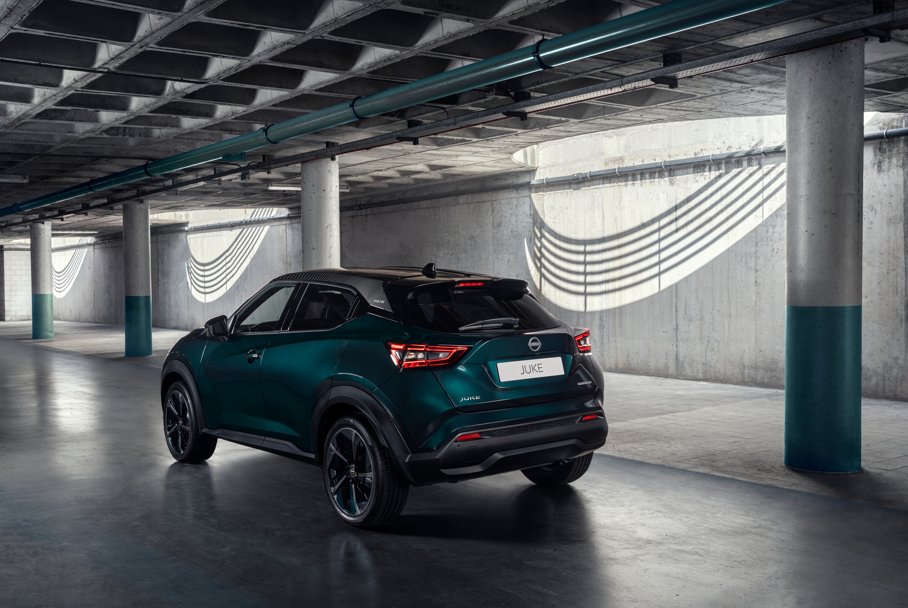 Dark green SUV parked in a concrete structure.