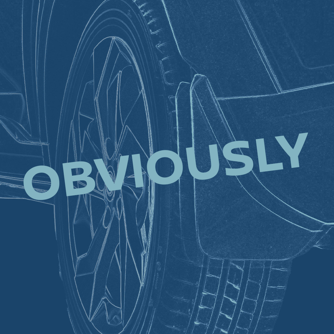 Car tyre and wheel close-up with the word obviously overlayed.