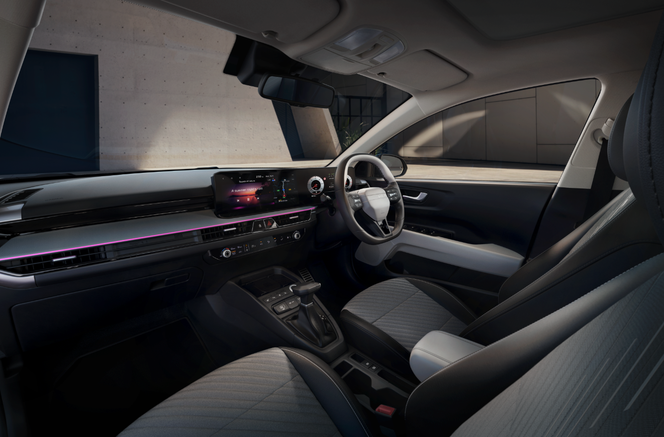 Interior of a modern car showing steering wheel and dashboard.