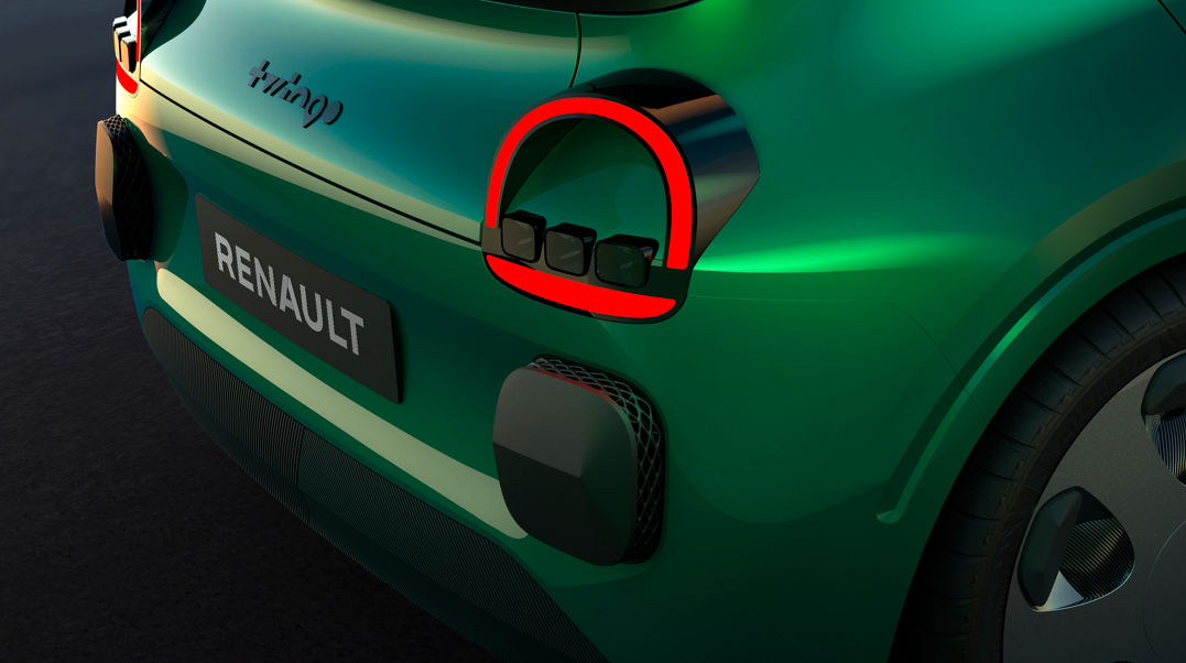 Close-up of a green Renault car's rear with distinctive tail light design.