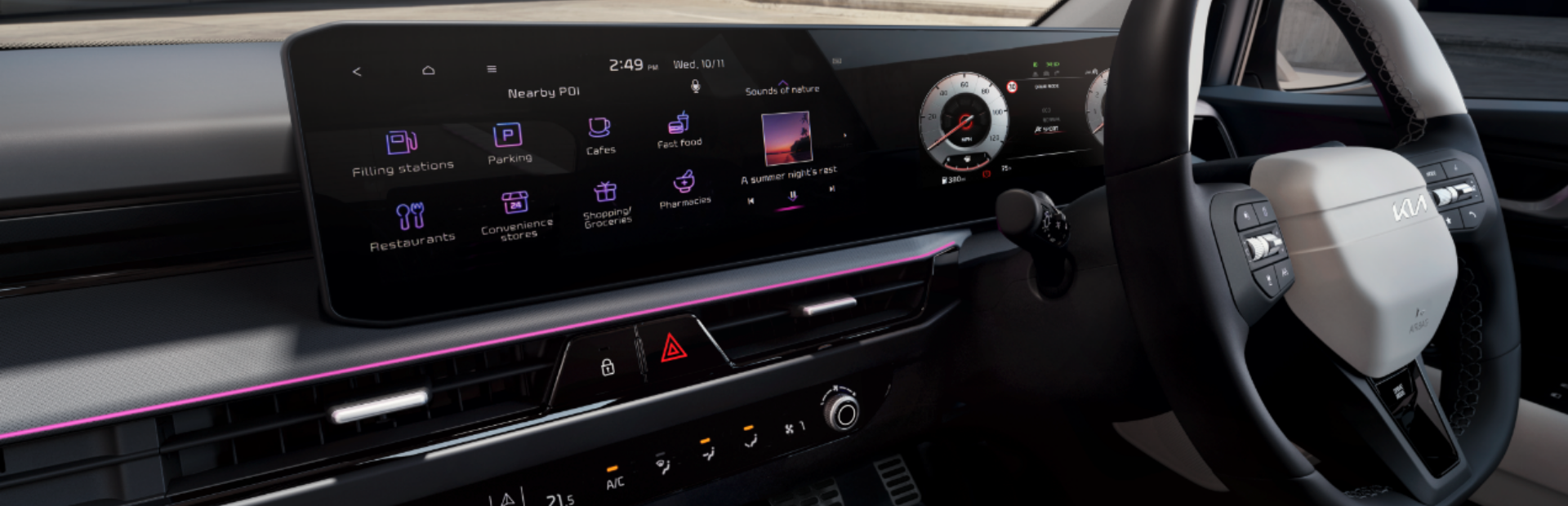 Car dashboard with digital display and multifunction steering wheel.