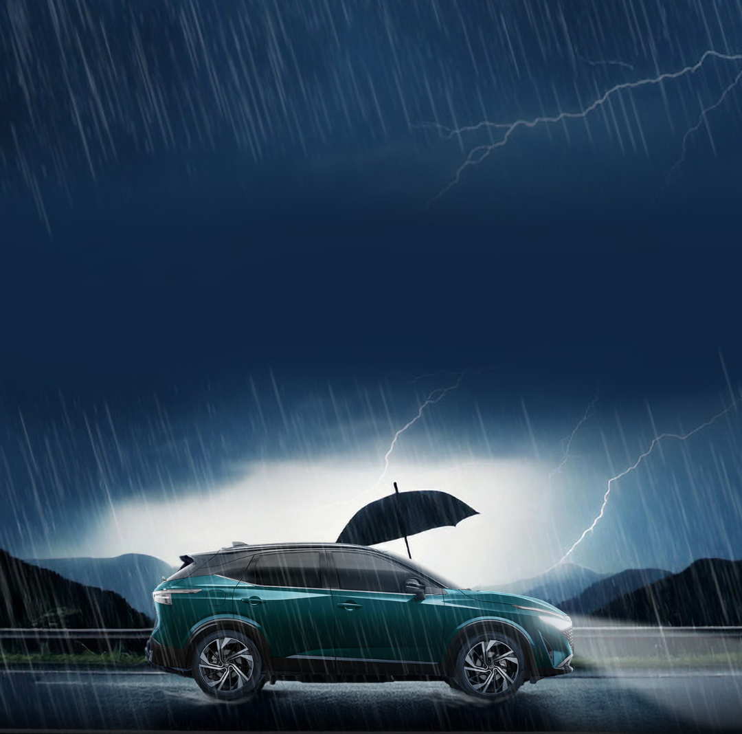 Car parked in rainstorm with an umbrella on the roof.